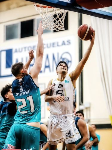 Andres Matute defending the basket
